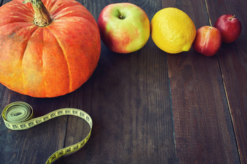 healthy concept with lemon, Pumpkin, bananas, ginger put and centimeter