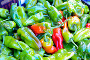 Organic green raw peppers at farmers' market.