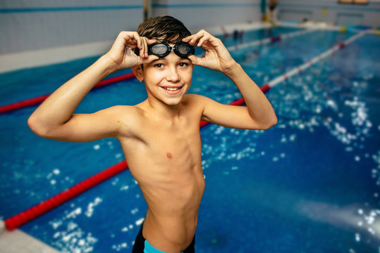 young boy wearing swimming goggles