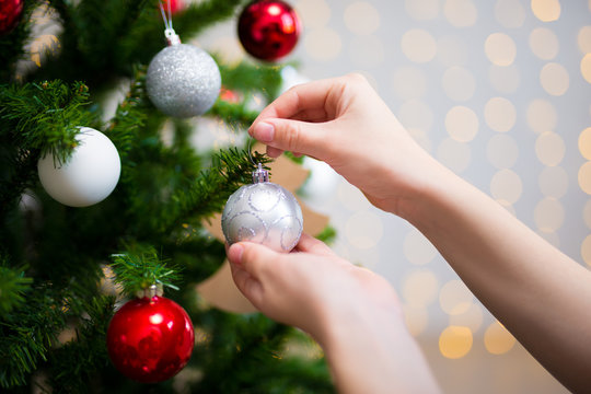 holiday background - girl decorating christmas tree