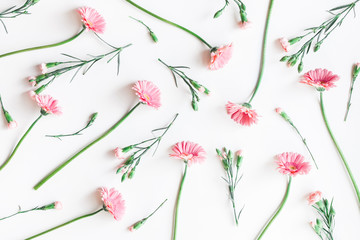 Obraz na płótnie Canvas Flowers composition. Pattern made of pink flowers on white background. Flat lay, top view, copy space