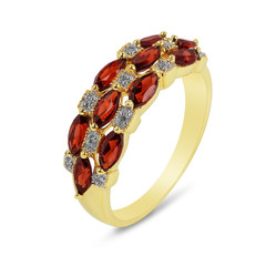 Golden ring. Golden ring with garnets isolated on white background. Ring with diamonds and garnets.