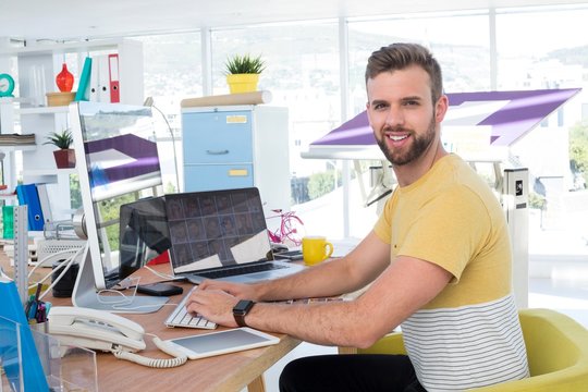 Male executive working on computer at desk