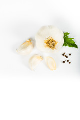 Garlic and herbs isolated on white background, top view