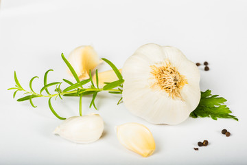 Garlic and herbs isolated on white background
