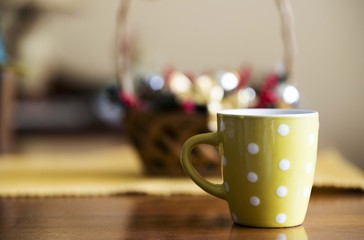 green cup of black coffee on wooden table