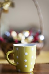 green cup of black coffee on wooden table