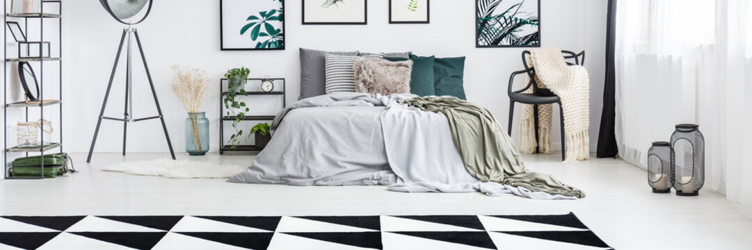 Spacious bedroom with geometric carpet