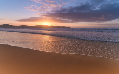 Fototapeta na wymiar Sunrise Seascape at the Beach