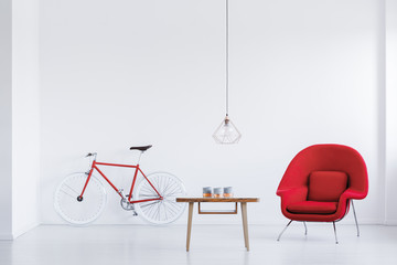 Red armchair in bright apartment