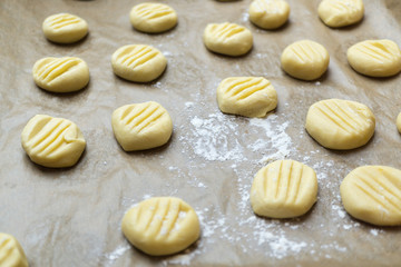 Fototapeta na wymiar Handmade gnocci on baking tray white flour