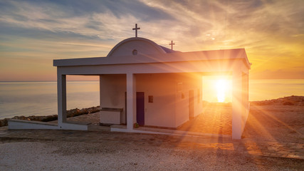 Obraz premium Cyprus, Mediterranean Sea coast. Agioi Anargyroi church at Cape Greco at sunrise