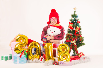Young man showing cheerful gestures with happy presents on Christmas Eve. In his home