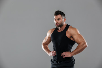 Fototapeta na wymiar Portrait of a muscular serious male bodybuilder