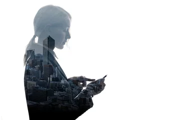 Double exposure of businesswoman and building exterior. © metamorworks