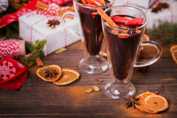 Mulled wine with fruits, cinnamon sticks, anise and decorations