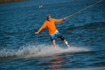 Enthusiastic man riding a wakeboard