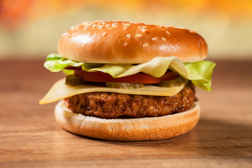 Fresh hamburger on wooden table