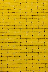 Yellow background. A yellow wall. The yellow brick. Large brick wall