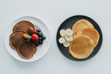 top view of various pancakes on white table