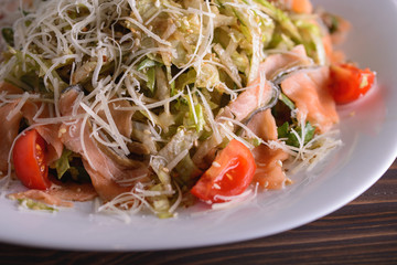 salad meal with smoked fish and cheese