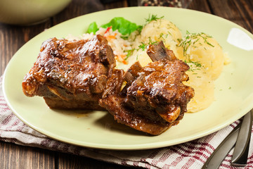 Pork spare ribs served with mashed potatoes and sauce