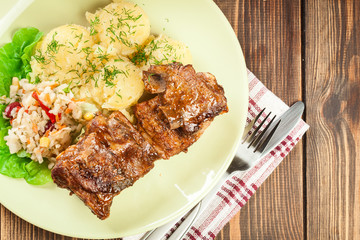 Pork spare ribs served with mashed potatoes and sauce