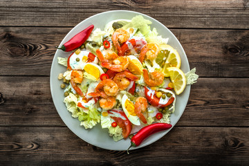 Shrimp salad with vegetables, healthy lunch rich in protein and vitamins, weight loss concept