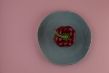 red pepper on a pink background