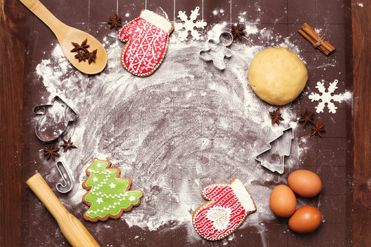 Raw dough ready for baking on brown table Bakery ingredients eggs flour  Christmas shapes for making cookies space for text - Powered by Adobe