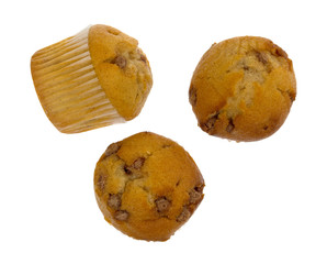 Top view of three bite size apple spice muffins with one on its side isolated on a white background.