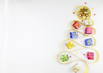 Golden ribbons Gift boxes New year accessories.Christmas concept copy space,Top view,flat lay