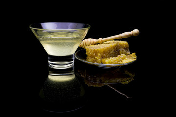 organic honeycomb with honey isolated on black background with r