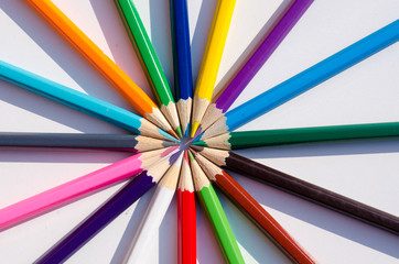 colored pencils on a white background