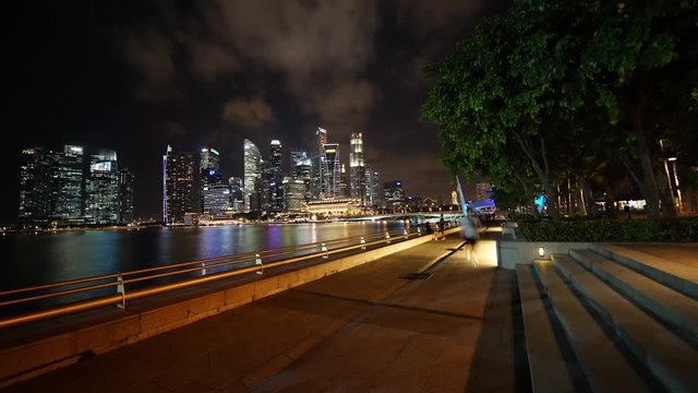 Singapore - November 27, 2017: Beautiful night landscape in Marina Bay Sands Singapore with skyscrapers and colorful light. Shot in 4k resolution