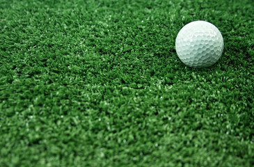 Golf ball on grass.