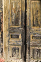 Old weathered vintage grunge retro wooden rural house door closeup