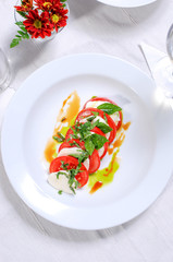 Fresh tomato salad with basil and cheese