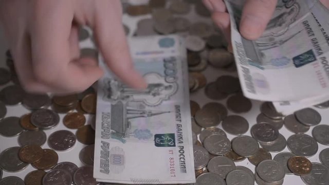 russian money rubbles and coins over white table Hands count money slow motion hd footage abstract for you ideas