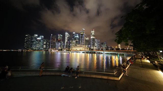Singapore - November 27, 2017: Time lapse footage of beautiful panorama of Singapore city with skyscrapers in Marina Bay Sands at night. Shot in 4k resolution