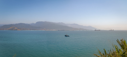 Aerial Panoramic view of Sea from Piuva viewpoint with Sao Sebastiao on background - Ilhabela, Sao Paulo, Brazil