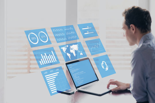Businessman with holographic AR screen business analytics financial dashboard, fintech - Powered by Adobe