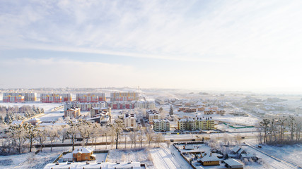 Aerial winter top down view high above rural slow living by small river.