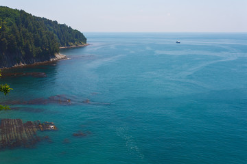 Beautiful view from the high coast to the sea and the beach with coastal reefs