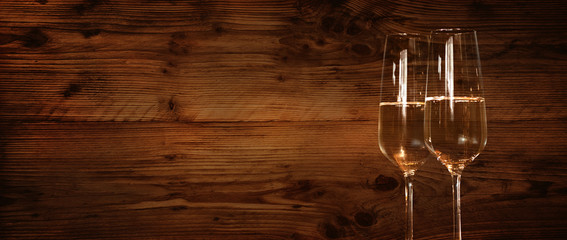 Wooden wall with champagne glasses