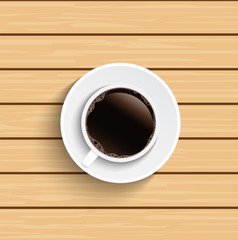 Coffee cup on wooden table top view.