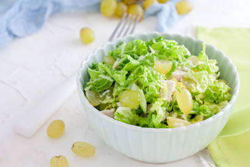 Fresh salad with chicken, green salad and grapes, horizontal