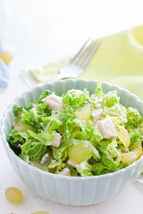 Salad with chicken and grapes, selective focus
