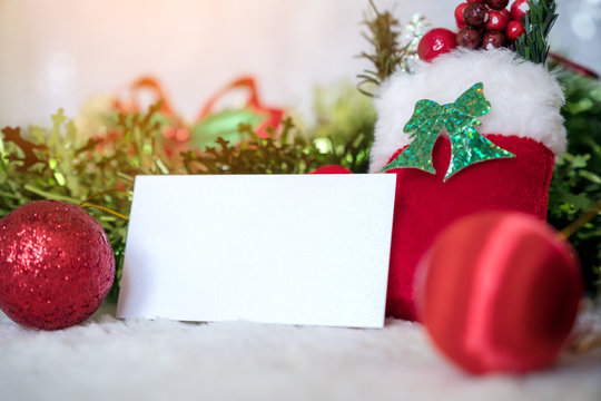 Mockup image of white blank name card with christmas decorations on wooden background