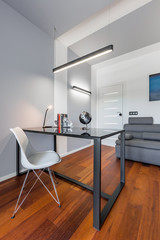 Home office with glass desk